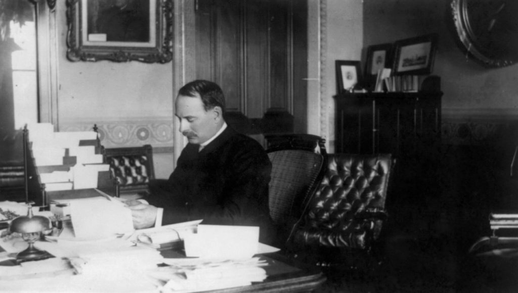 Image of William C. Whitney at his desk when he served as Secretary to the Navy.